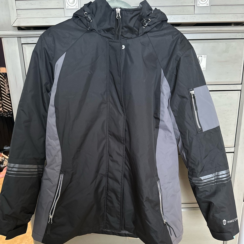 Brand new ski jacket never used black and grey with an additional aqua jacket